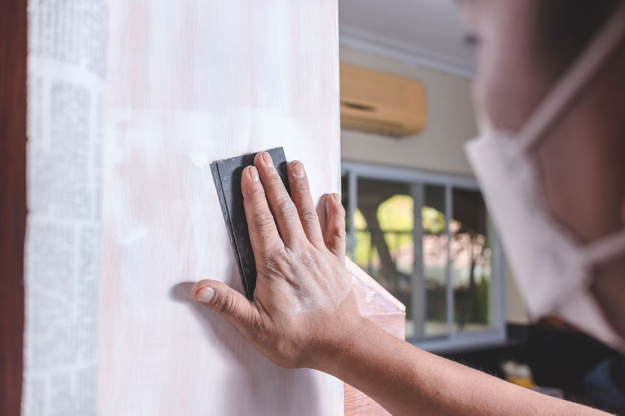 sanding a cabinet