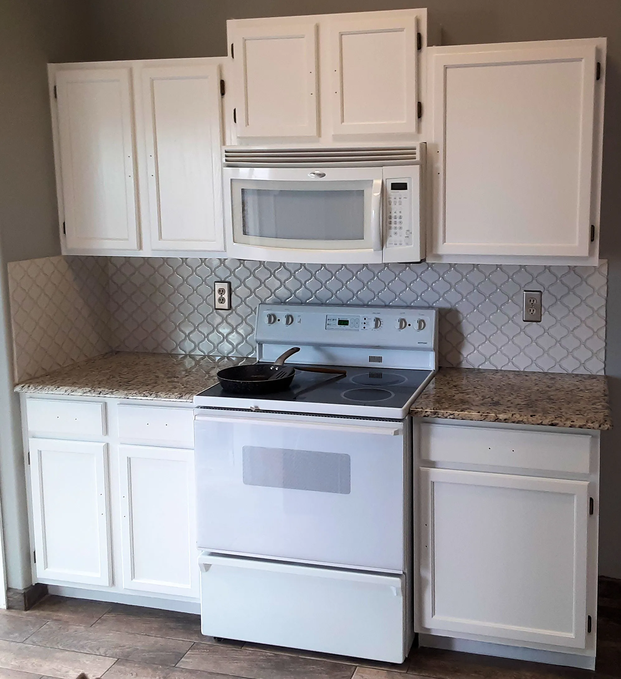 Freshly painted kitchen cabinets look so good!